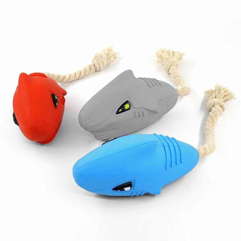 Rubber shark toys for dogs, durable and squeaky, with cotton rope for active jaws.