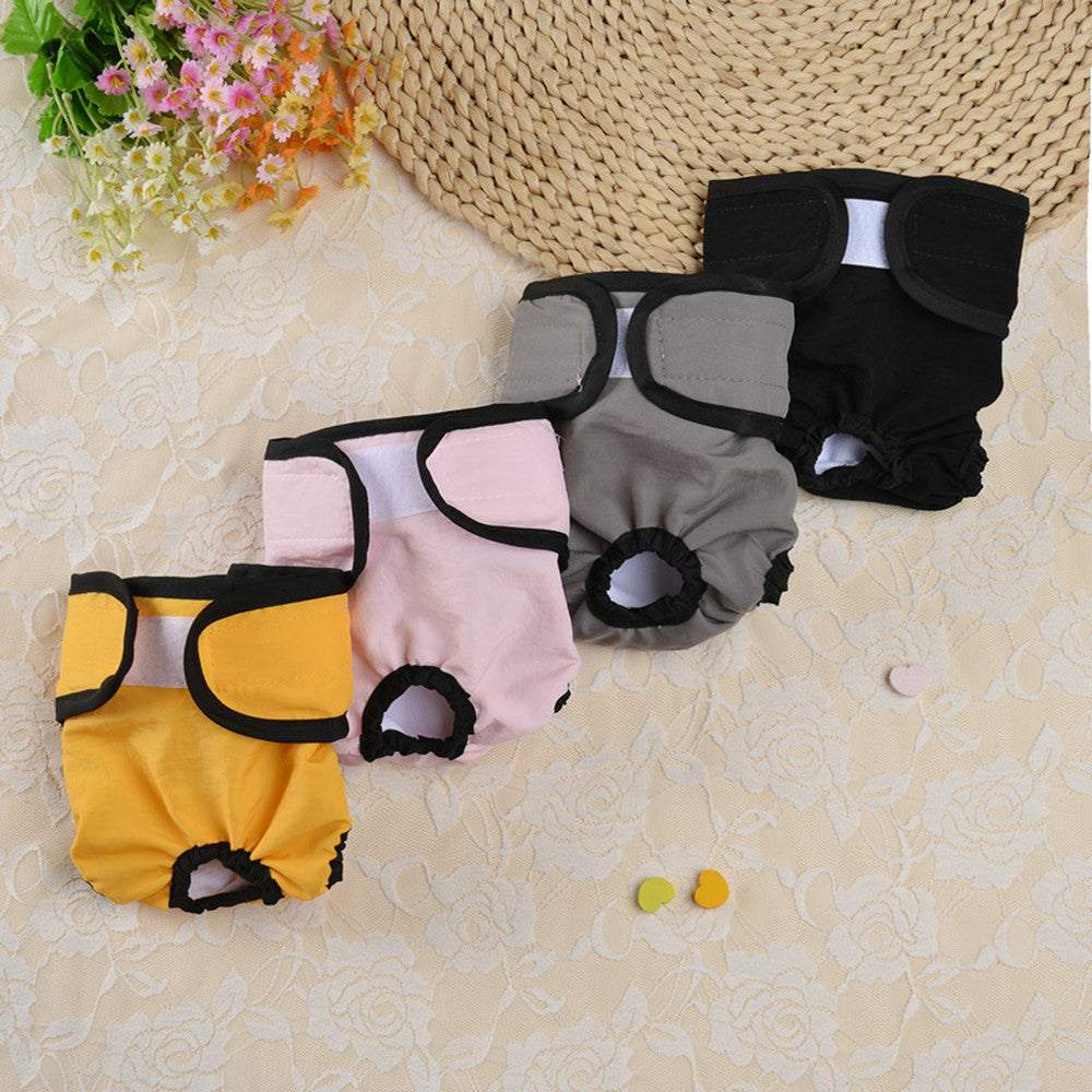Menstruation safety culottes for dogs in various colors displayed on a beige surface.