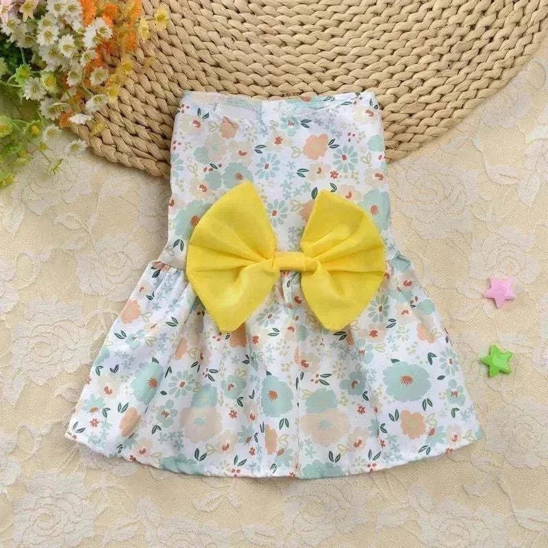 Princess-style floral pet dress for small dogs and cats, featuring a breathable cotton material and elegant design, perfect for sunny days.