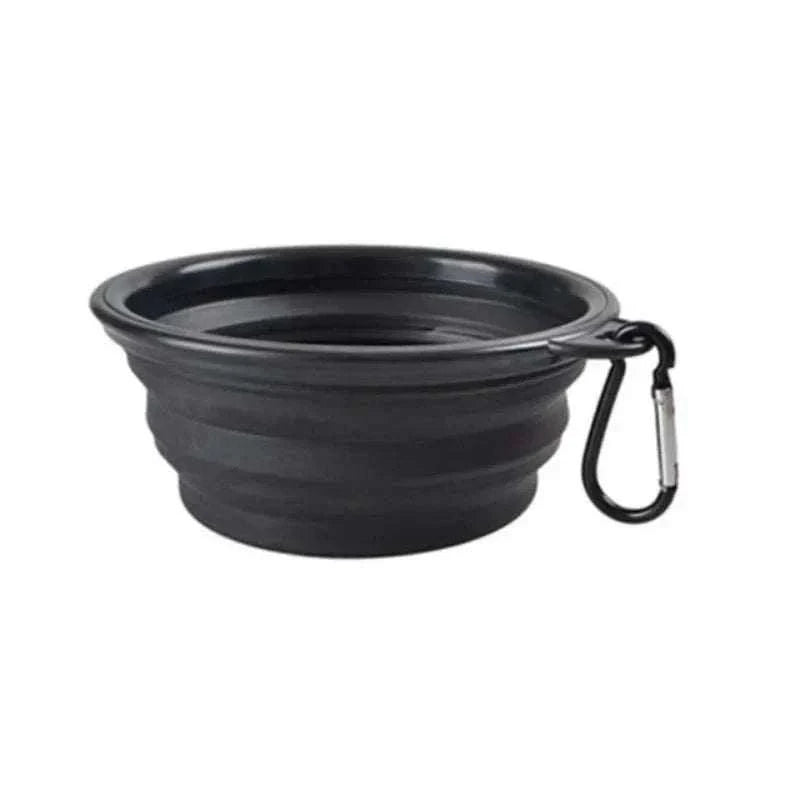 Portable silicone bowl for pet food and water, lightweight and foldable with a carabiner; ideal for travel and outdoor adventures.