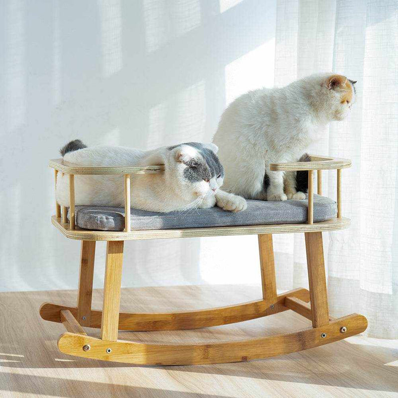 Comfortable INSTACHEW Rockaby pet bed with plush cushion for cats and dogs, made of durable bamboo wood.