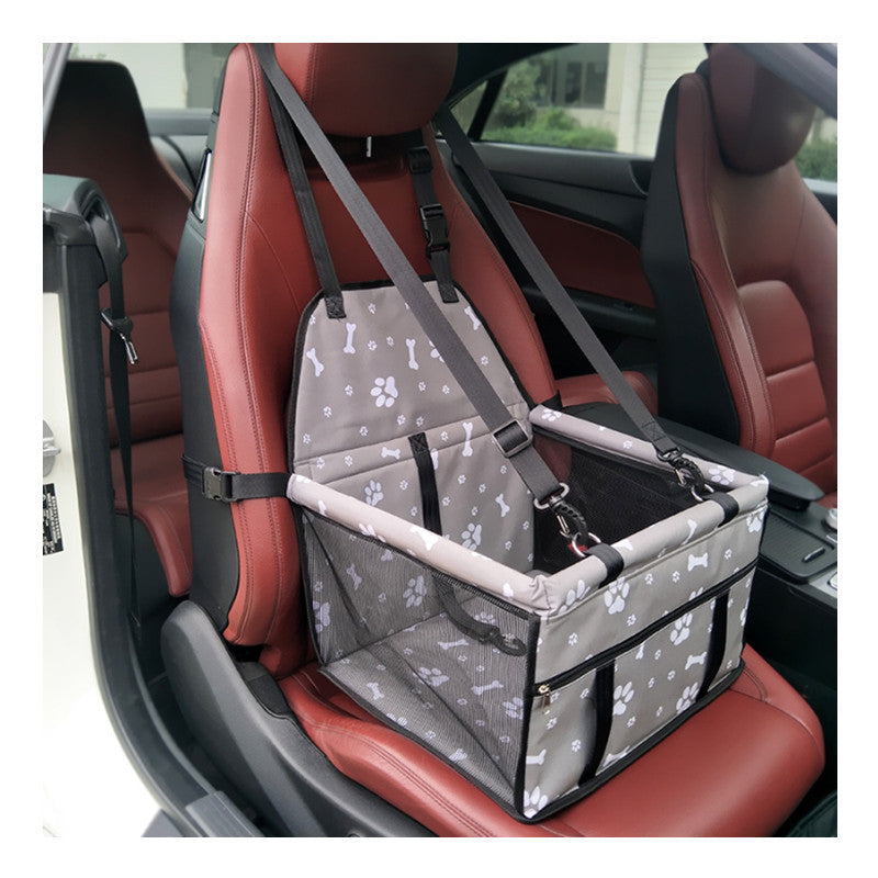 Collapsible and breathable pet travel carrier in a car seat, offering secure and comfortable transport for small to medium-sized pets.