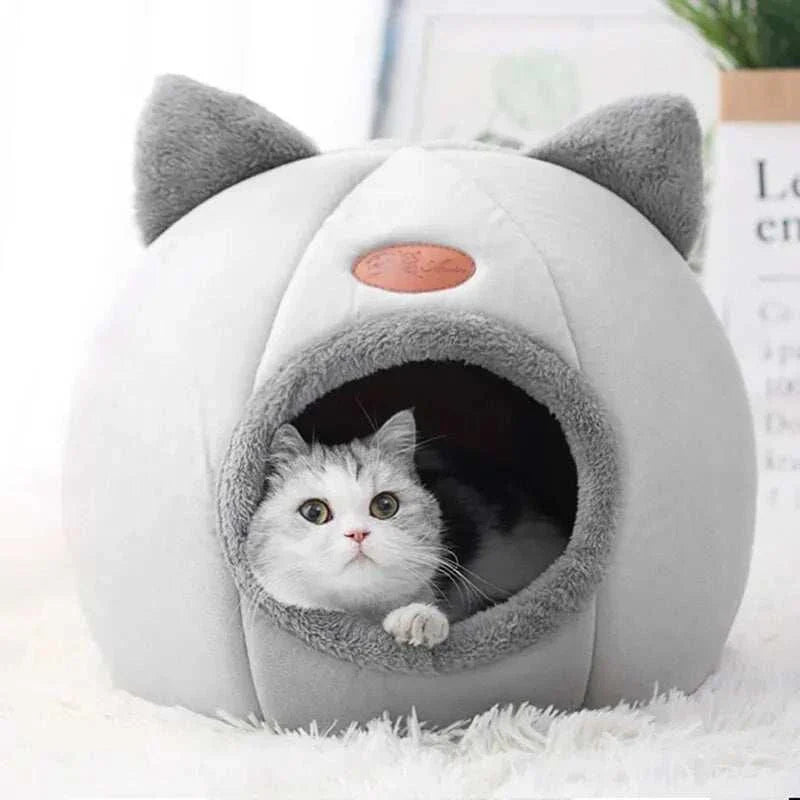 Maison pour chat douillette en forme de tête avec ouverture ronde, lit chaud et antidérapant, adaptée pour 4 saisons.